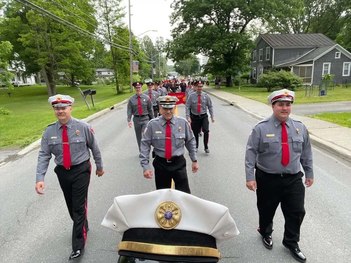 Parade View Over the Brass Bell — Looking over the hood of the 1928 American LaFrance following the Ghent color guard.