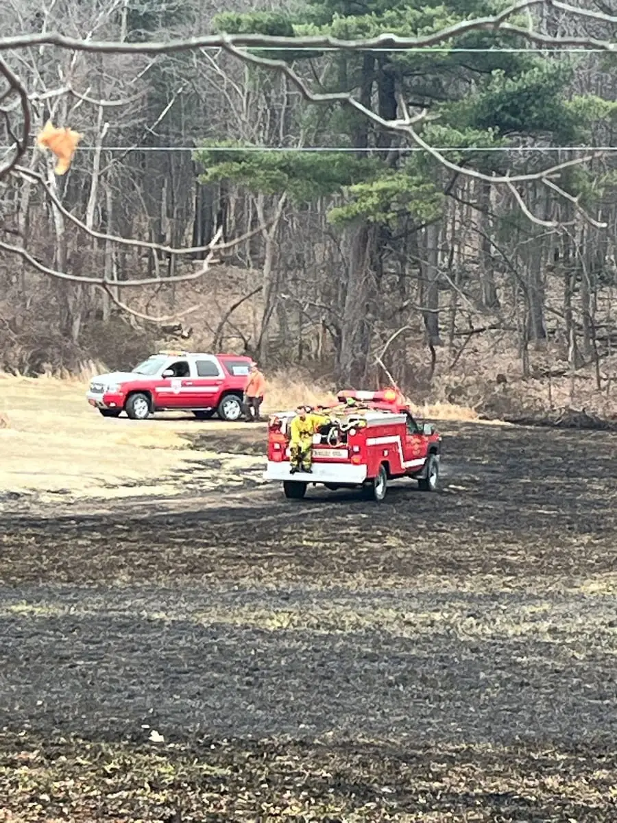 Brush 22-69 operating in a burned field during a Ghent brush fire response