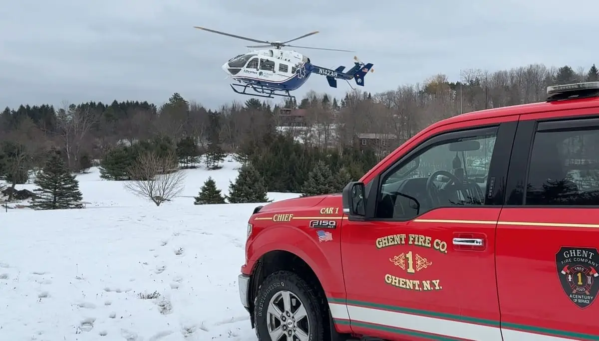 Chief Car 22-71 (marked Chief Car 1), a red Ford F-150 XLT 4x4 command pickup establishing a snowy medevac landing zone with a LifeNet helicopter.