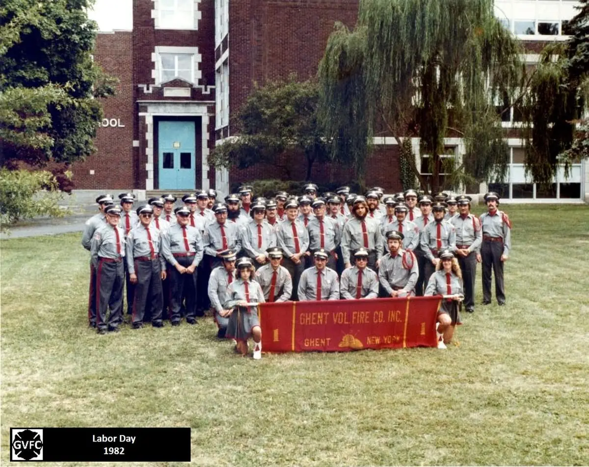 Labor Day Parade Assembly, 1982 — Ghent Volunteer Fire Company members assembled in dress uniform with the company banner in 1982.