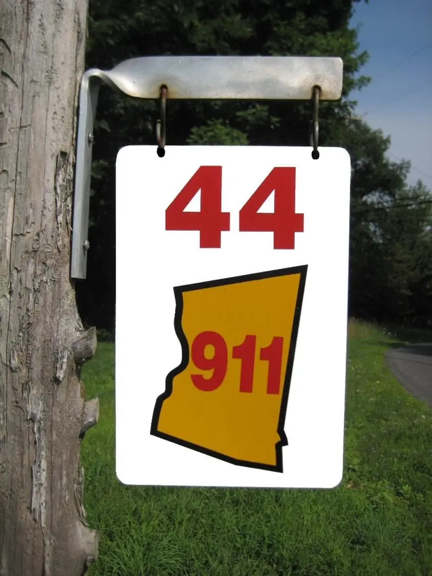 Reflective green 911 address sign installed at a Ghent driveway